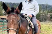 Pastor Ethan riding a mule